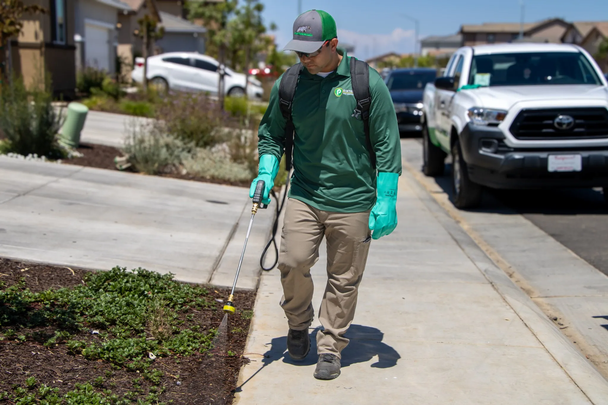 Pointer Pest Control technician performing a routine bi-monthly service visit at a Roseville CA home