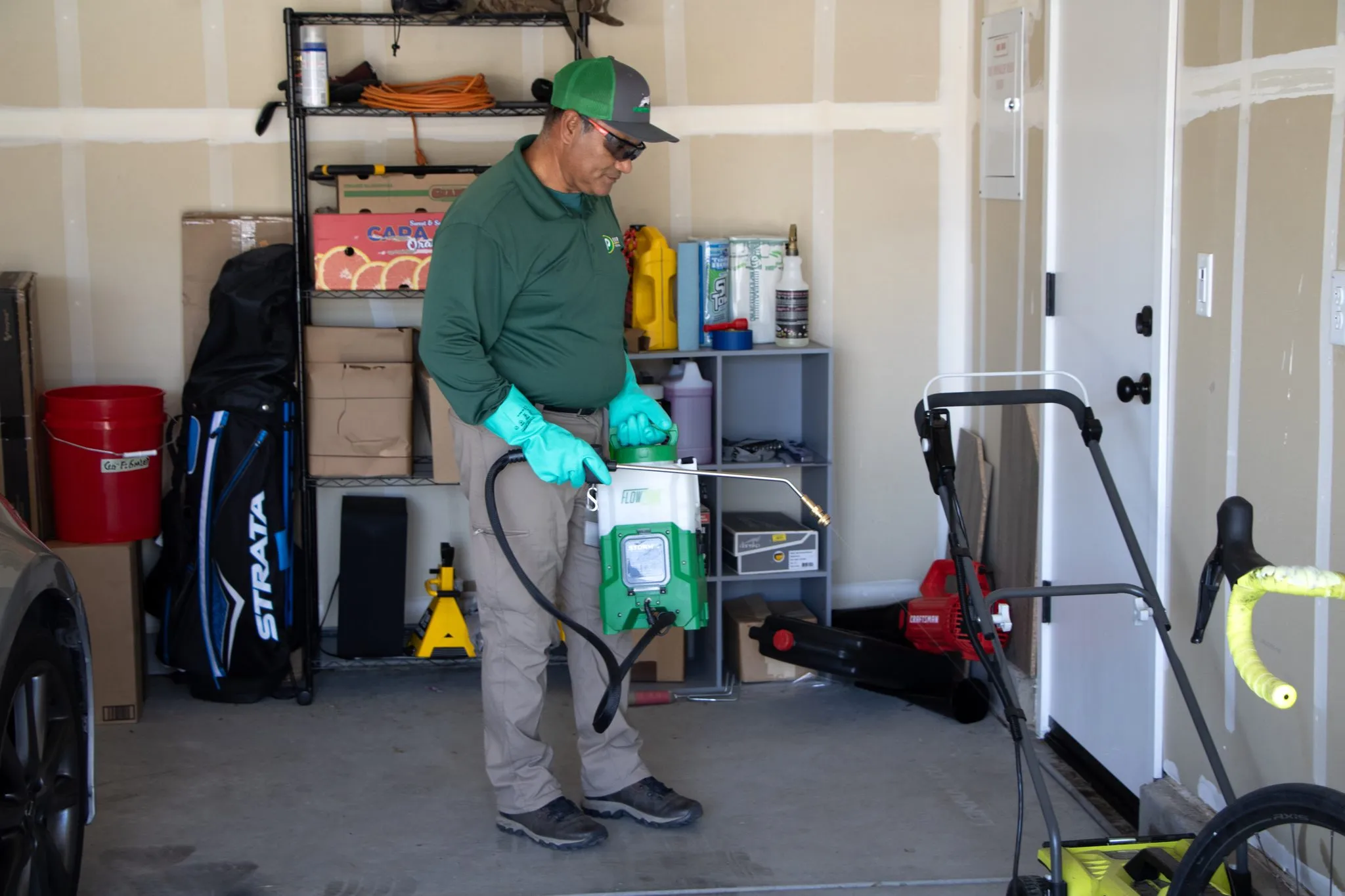 Pointer Pest Control technician servicing a garage interior during a rodent visit in Roseville CA