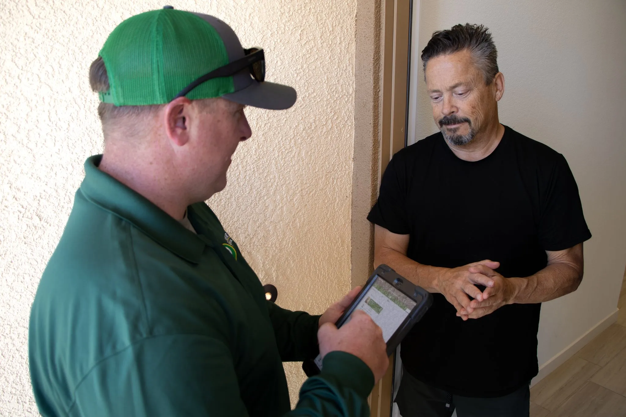 Pointer Pest Control technician reviewing rodent findings with a homeowner in Roseville CA