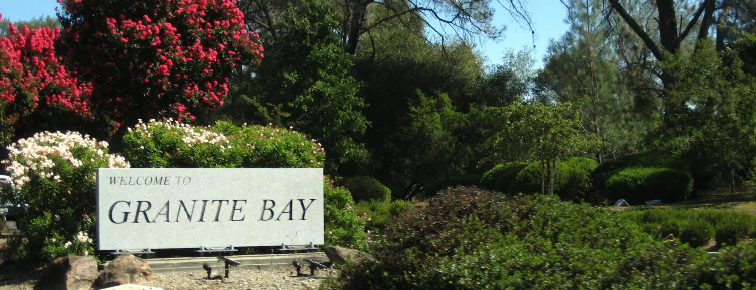 Welcome to Granite Bay monument sign surrounded by flowering landscaping